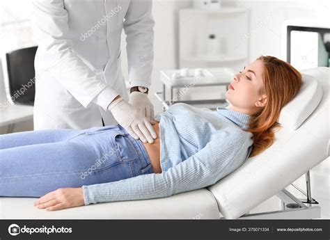 Gastroenterologist Examining Woman Clinic Stock Photo by ©serezniy ...