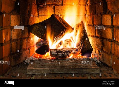 burning wood in fire-box of fireplace Stock Photo - Alamy