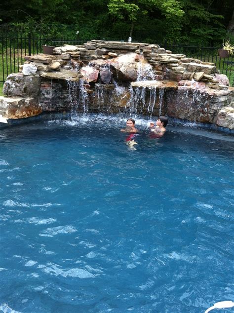 Pool waterfall! | Fire pit backyard, Rustic fire pits, Modern fire pit