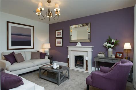 This living room has a colour scheme of beautiful heather tones which carries through from the ...