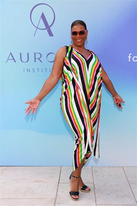 Queen Latifah Bursts In Colorful Low-Cut Dress & Studded Wedges ...