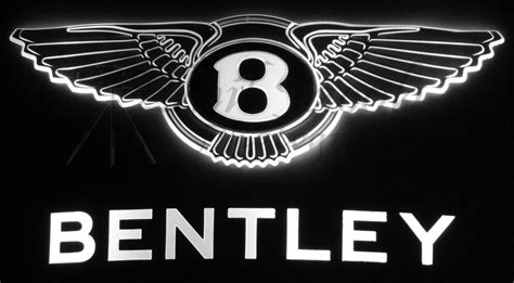 the bentley logo is lit up in black and white