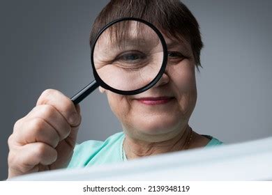 Elderly Woman Reads Magnifying Glass Her Stock Photo 2139348119 | Shutterstock
