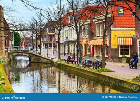 Street View with Houses and Canal in Delft, Holland Editorial Stock Photo - Image of horizontal ...