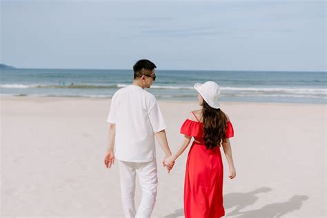 Couple Holding Hands at the Beach · Free Stock Photo