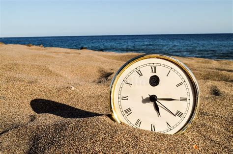 Clock on the Sand Beach stock image. Image of holiday - 116235289