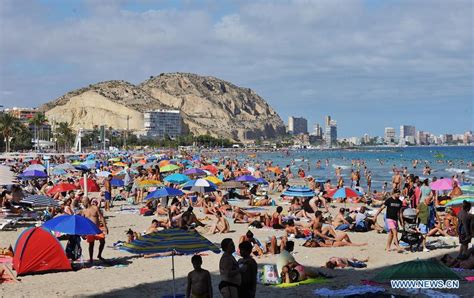 In pics: seaside in sweltering weather in Alicante, Spain - Xinhua ...