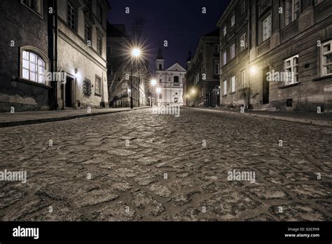 The street of the old town in Warsaw at night Stock Photo - Alamy