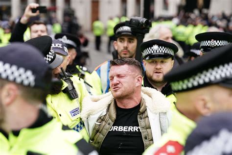 Tommy Robinson sprayed by police during arrest at march against ...