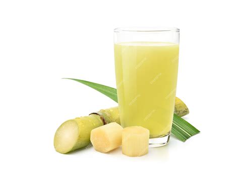 Premium Photo | Fresh squeezed sugar cane juice with fresh cane sliced isolated on white background.