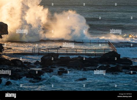 Sunrise at North Curl Curl Beach with huge swells and surf Stock Photo ...