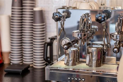 Premium Photo | The barista prepares fresh coffee in the coffee machine ...