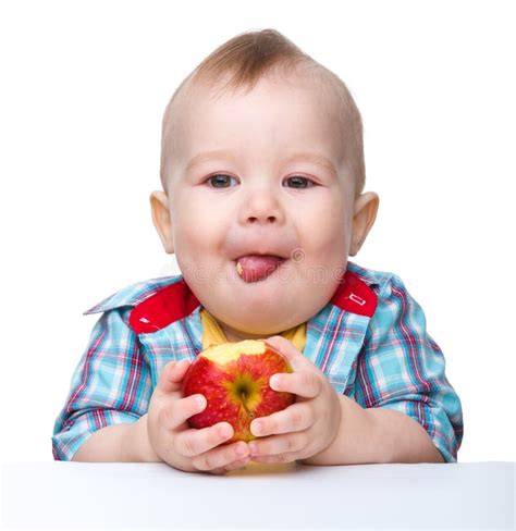 Little Child is Eating Red Apple Stock Image - Image of cute, closeup: 19176653