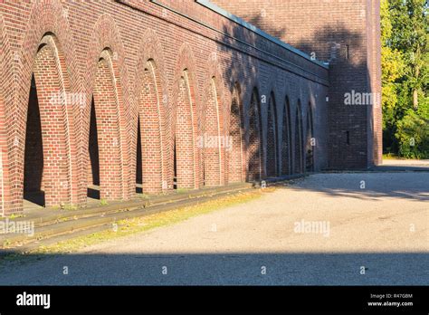 building with round arches of brick Stock Photo - Alamy