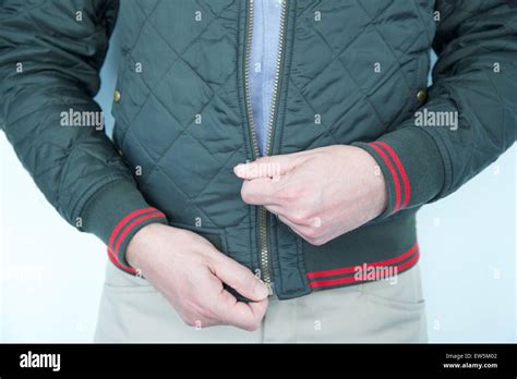 Zipping up jacket hi-res stock photography and images - Alamy