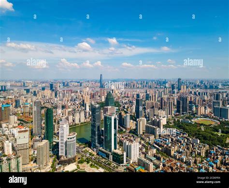 Aerial view of Wuhan skyline and Yangtze river with supertall skyscraper under construction in ...