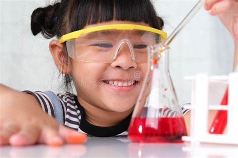 Children are Learning and Doing Science Experiments in the Classroom. Little Girl Playing ...