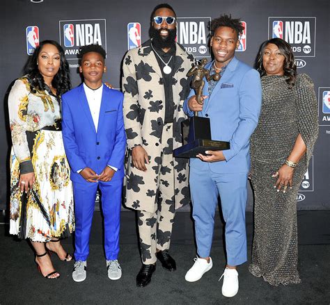 James Harden (C), winner of the 2017-2018 MVP award, poses with his mom ...