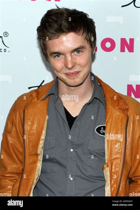 Actor Tyler Johnston poses for photographers on the red carpet at NYLON magazineÕs 12th ...