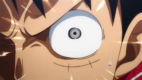 an anime character with large round eyes and black hair is staring into the camera lens