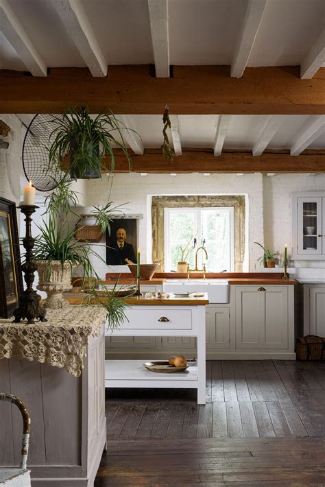 A country kitchen with wooden floors and original beams | Country kitchen, Freestanding kitchen ...