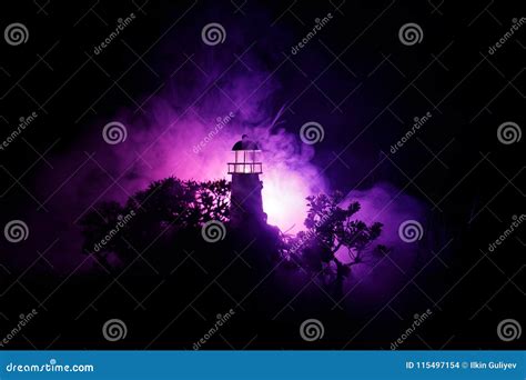 Lighthouse with Light Beam at Night with Fog. Old Lighthouse Standing ...