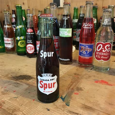 Vintage Spur Canada Dry soda bottle full