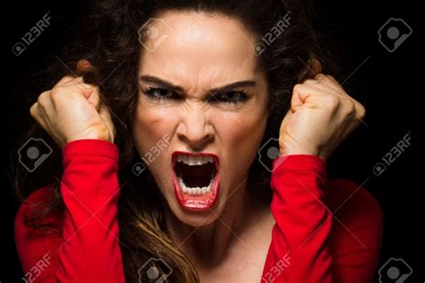 A very angry aggressive woman is clenching her fists in rage | Very ...