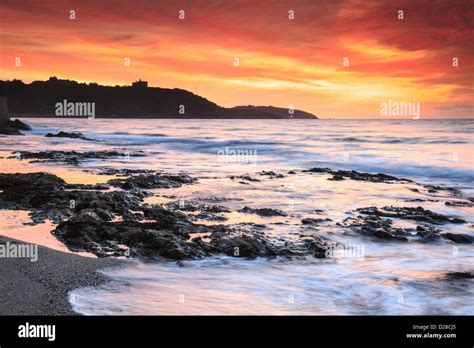 Sunrise captured from Falmouth's Gyllyngvase Beach , with Pendennis ...