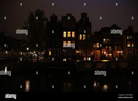 The city lights of Amsterdam in the night Stock Photo - Alamy