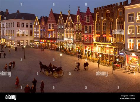 Bruges Belgium city centre at dusk, Christmas in the Market ( Markt ) Square, Bruges Belgium ...