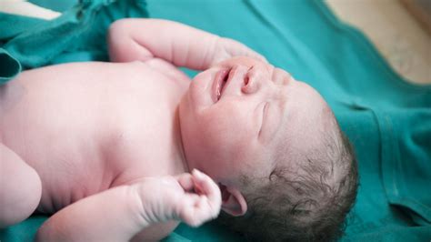 What Does It Mean If A Baby Doesn't Cry When They're Born? Experts Weigh In