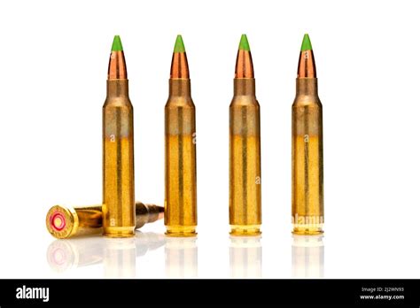 A group of 5.56 calibar, green tip bullets ordered into the line on white background Stock Photo ...