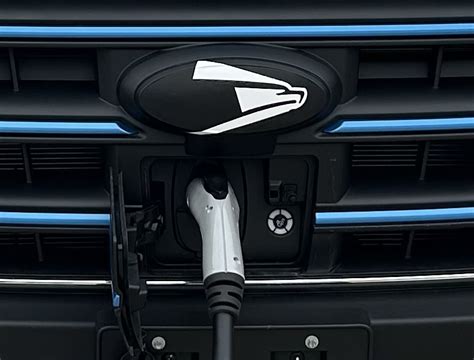 Charged EVs | US Postal Service unveils its first electric delivery vehicles and charging ...