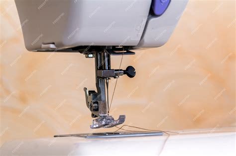 Premium Photo | Detail of sewing machine and sewing accessories.