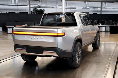 Rivian planning hundreds of layoffs following surge in staffing ...