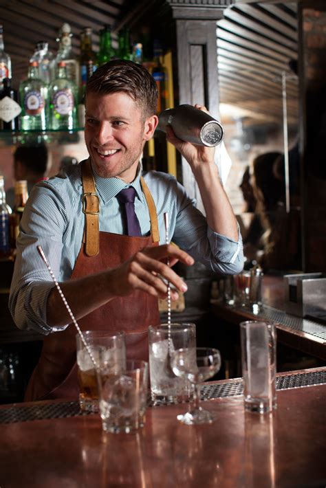 This bartender is so expert that he’s able to prepare several different cocktails at the same ...