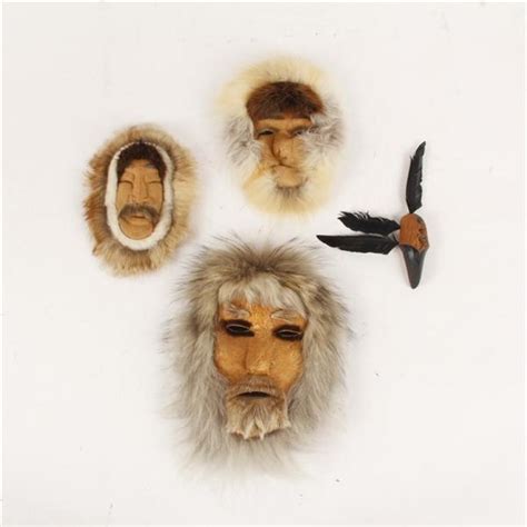 Lot - Eskimo / Inuit folk art 4pc. masks and carving with fur, hide, and feathers, signed.