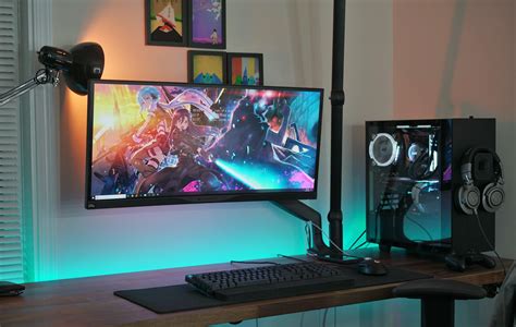 A single, ultrawide monitor setup built into a NZXT S340. That lamp helps create the perfect ...