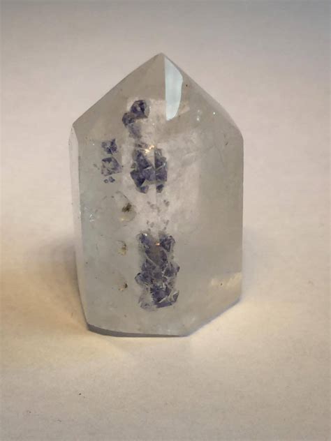 Cloudy quartz polished prism with blue fluorite inclusions