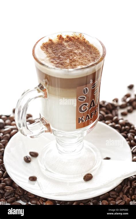 Cup of latte coffee on beans Stock Photo - Alamy