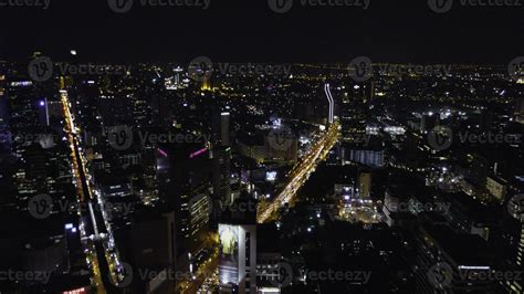 Aerial view of traffic at toll on expressway. Bangkok Expressway and Highway top view at dusk ...