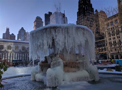 Frozen fountain in front of Bryant Park, New York City, USA