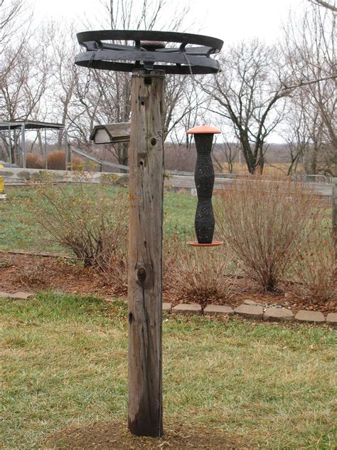 Repurposing - - bird feeder hanger from retired power pole and old cast ...