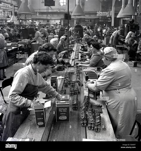 Historical, 1950s, female operatives working on the factory floor at the Ever Ready Battery ...