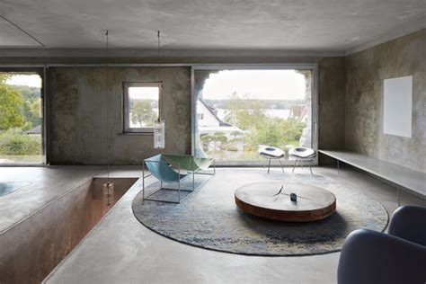 Inside Arno Brandlhuber’s Potsdam Bunker - One of the living-room spaces, with a table made of ...