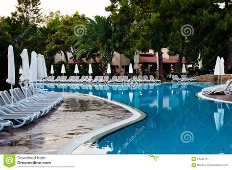 Swimming Pool and Palms in Hotel Stock Image - Image of water, pool: 64322751