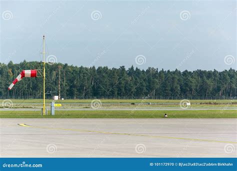 Red and White Windsock at an Airport Runway Stock Photo - Image of ...