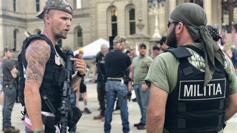 Armed militia supporters rally outside state Capitol | WOODTV.com