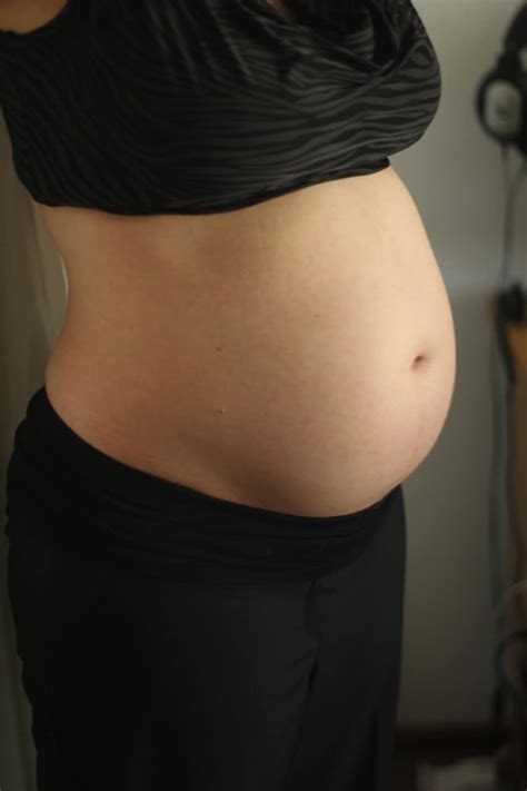 15 weeks pregnant belly appearance and symptoms